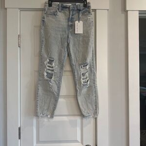 Distressed never warm wholes in knees distressed bottom skinny jeans